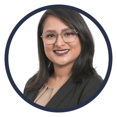 Board of Governors member Satinder Kaur smiles