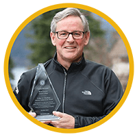 Bob Falle holding an award