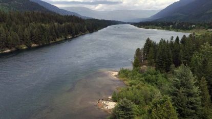An aerial view of the river adjacent to the Skattebo Education Forest