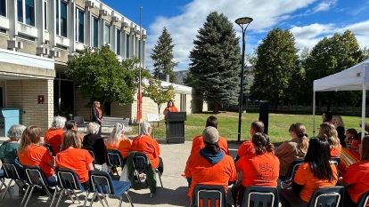 Group of people gathered outside the Castlegar Campus for the flag raising