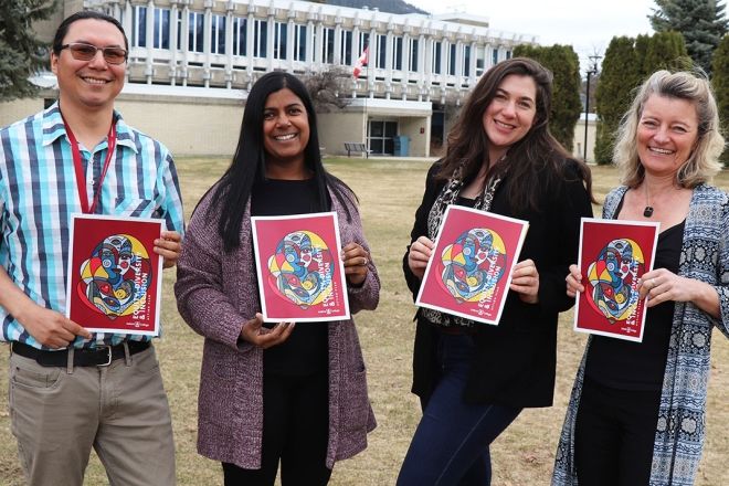 Members of EDI Committee hold action plan outside of Castlegar Campus.