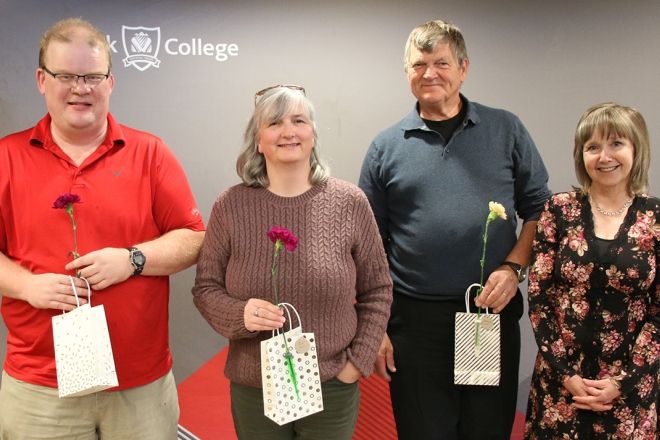 Group of 20 year service employees with President Maggie Matear.