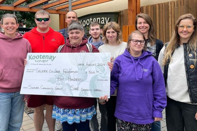 Students and instructors in the SOAR Program accept a big cheque from the Kootenay Co-Op grocery store
