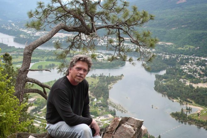 Myler Wilkinson sits outside by the Columbia River