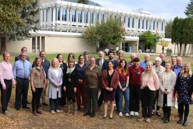 A group stands outside at the Castlegar Campus