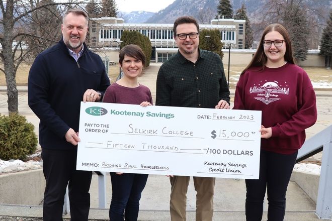 Cheque donation featuring Selkirk College and KSCU staff.