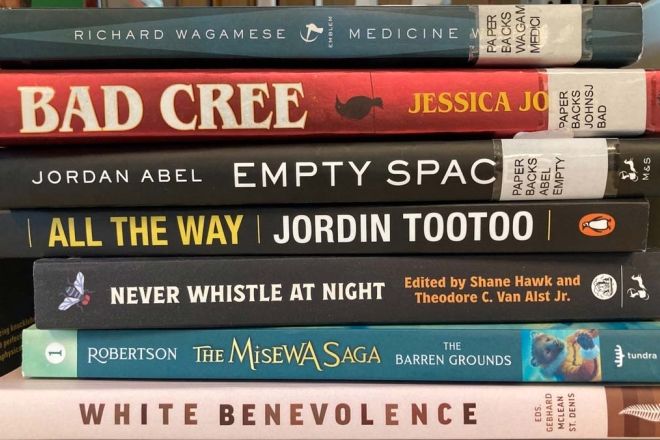 A stack of Selkirk Reads! books in the library