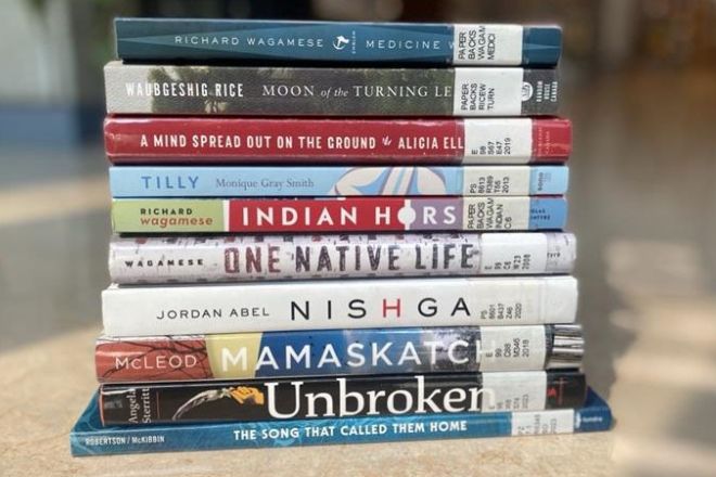 A stack of Selkirk Reads! books in the library