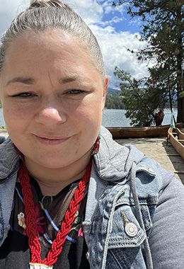 Chantal stands outside smiling